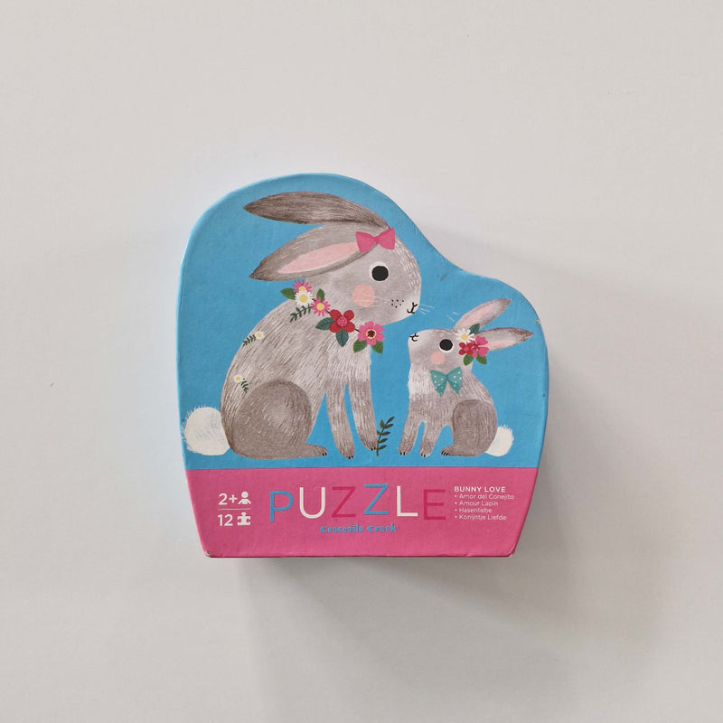 Puzzle box with rabbit illustration on a light gray background