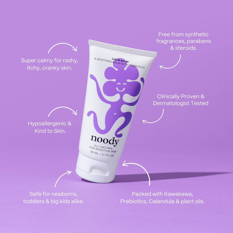 Tube of 'noody' cream balm on a purple background with text highlighting its benefits.