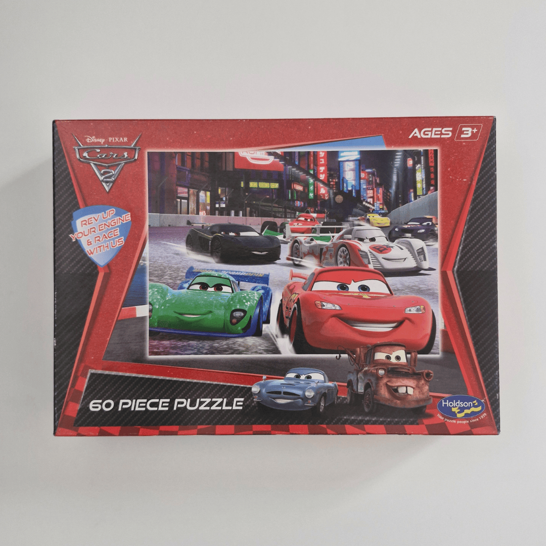 Puzzle box featuring cartoon cars with a red border on a gray background