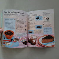 Open book with cooking instructions and illustrations on a plain background