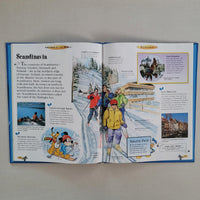 Open book with illustrations and text about Scandinavia on a flat surface