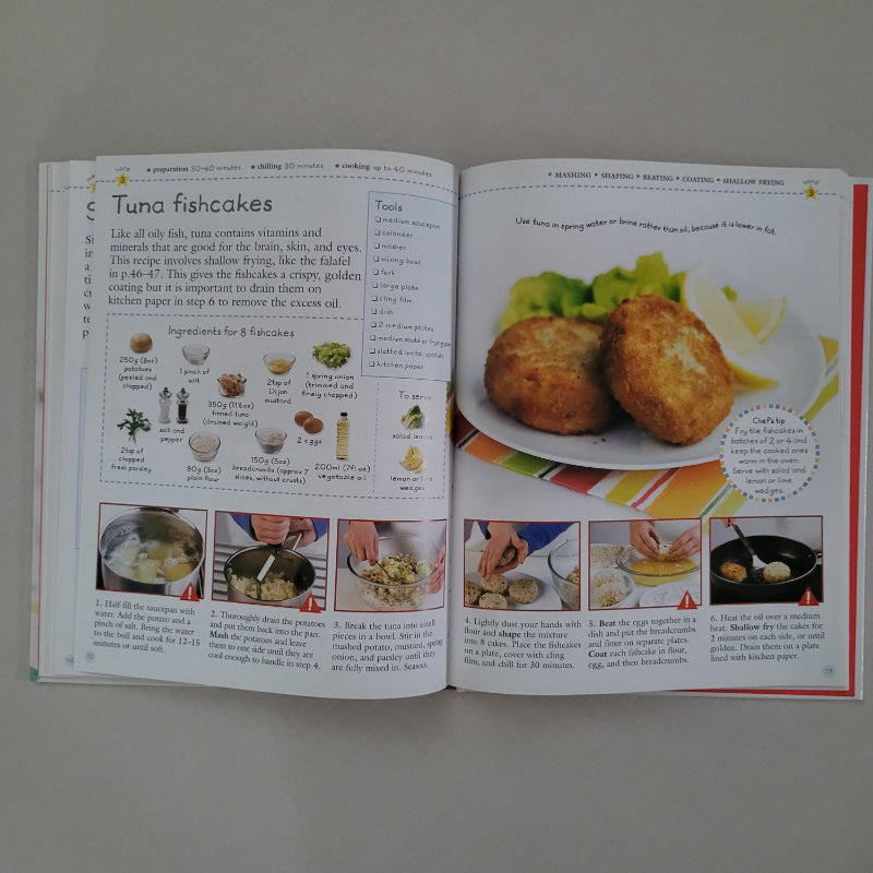 Open cookbook showing a recipe for tuna fishcakes with images and text.