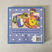 Children's book back cover with a colourful illustration of a steam train on a textured beige background