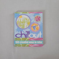 Colourful book titled 'chill out' with abstract designs on a gray background