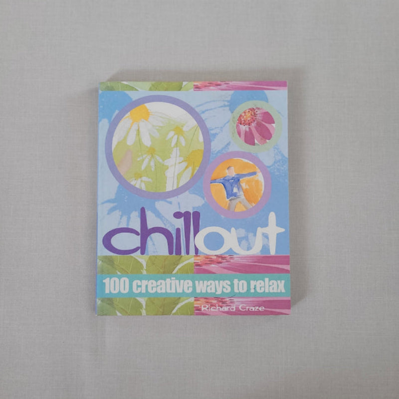 Colourful book titled 'chill out' with abstract designs on a gray background