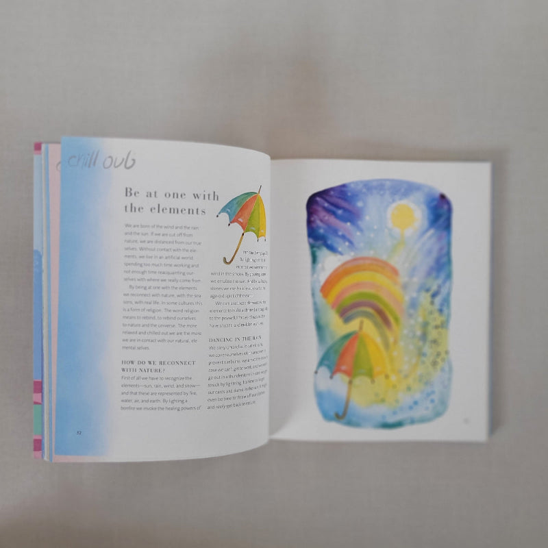 Open book with colourful illustration of a rainbow and sun on a white background