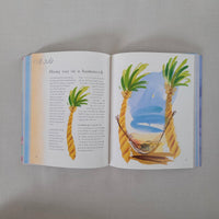 Open book with illustrations of a beach scene and text on a gray background