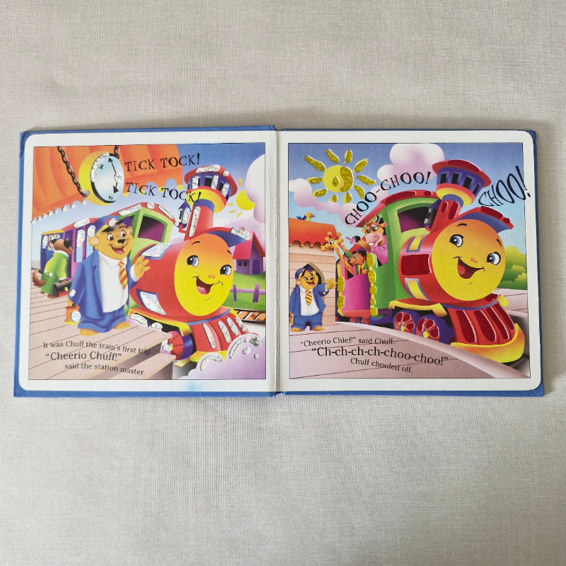 Colourful children's book open on a textured surface