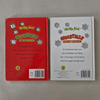 Back covers of a Christmas-themed book with red and white colour scheme on a textured surface.