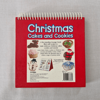 Red book back titled 'Christmas Cakes and Cookies' on a grey background