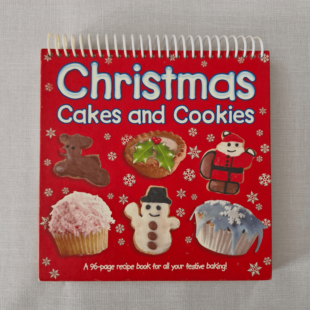Book titled 'Christmas Cakes and Cookies' with festive illustrations on a red cover.