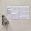 Cookie Recipe Card with metal cookie cutter on plain background