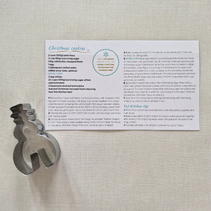 Cookie Recipe Card with metal cookie cutter on plain background