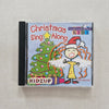 CD cover of 'Christmas Along Sing Along' by Kidz Up on a textured surface