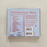 Back cover of a ChristmasSing-Along CD on a textured beige surface