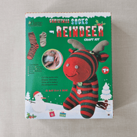 Box for a Christmas sock reindeer craft kit on a beige background