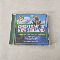 CD cover of 'Christmas in New Zealand' featuring a Santa Claus illustration on a textured surface.