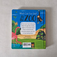 Children's book titled 'What Can You See at the Zoo' on a gray surface