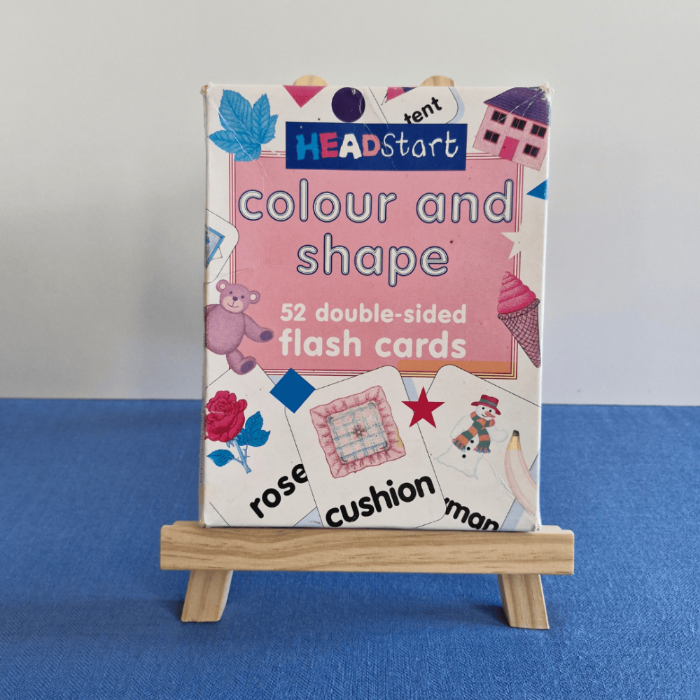 Colour and shape flash cards packaging on a stand against a blue background