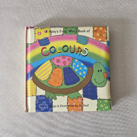 Colourful children's book with a turtle illustration on a gray background