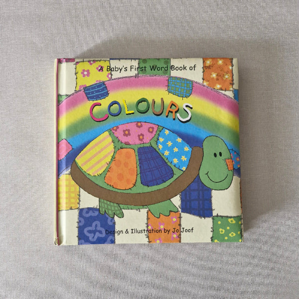 Colourful children's book with a turtle illustration on a gray background