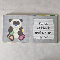 Children's book with a panda illustration and text on a gray background