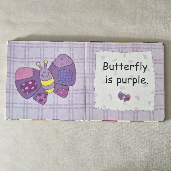 Purple butterfly-themed book page with a label on a beige background