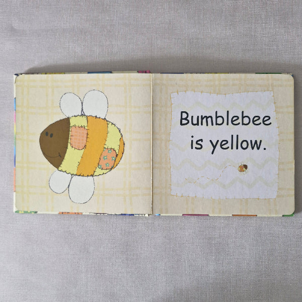 Children's book with a bumblebee illustration and text on a gray background
