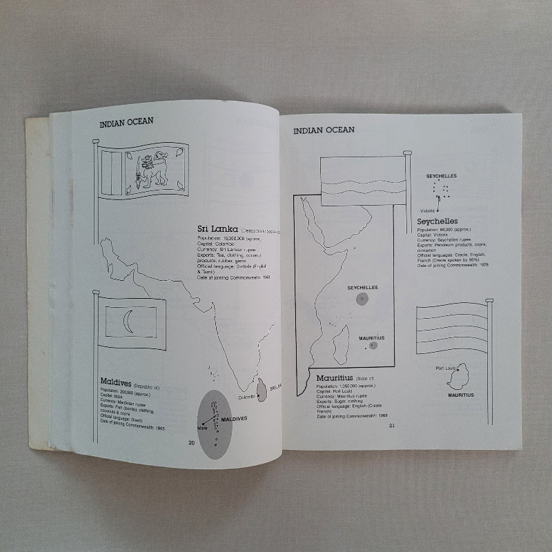 Open book with diagrams and text on a plain background