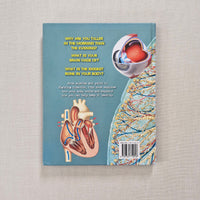 Book back cover with anatomical illustrations on a textured surface