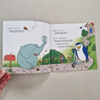 Open book with illustrations of a penguin and an elephant on a textured surface