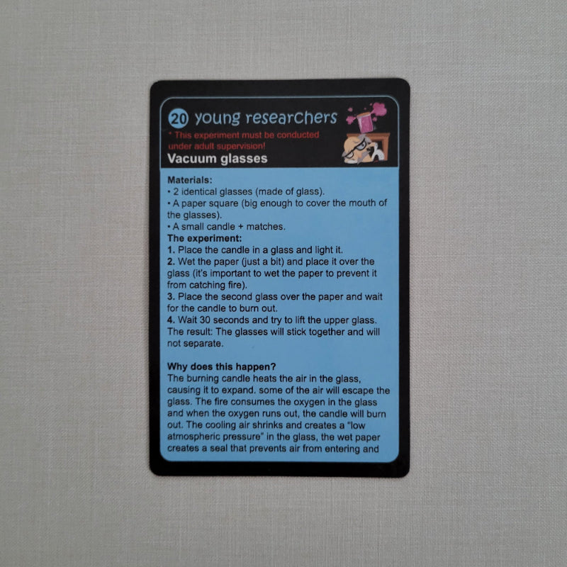 Card with text about vacuum science experiment and a small illustration on a gray background