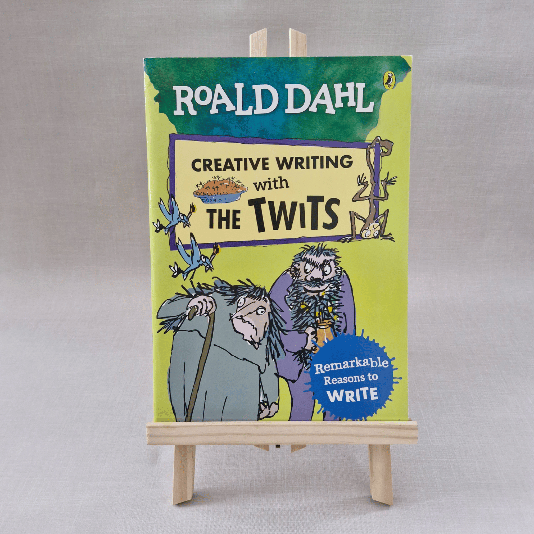 Book titled 'Creative Writing with The Twits' by Roald Dahl on a small easel against a grey background