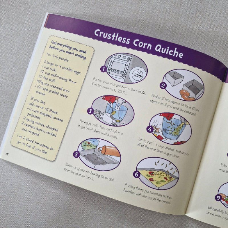 Open book with a recipe for 'Crustless Corn Quiche' on a gray surface