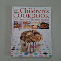 Children's cookbook with a muffin on the cover against a light gray background
