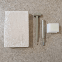 Plaster excavation block with chisel tools and sponge