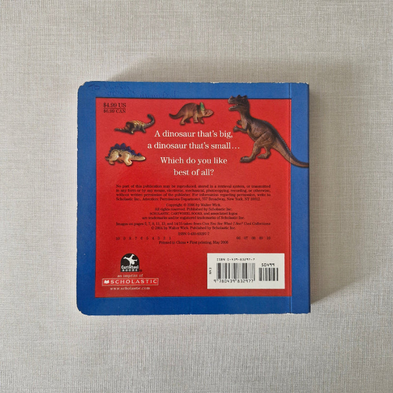 Back cover of a book with dinosaur illustrations and text on a textured surface
