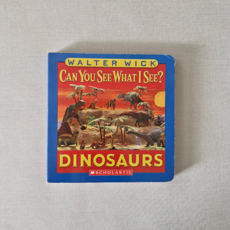 Children's book cover with dinosaurs on a textured surface