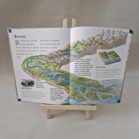Open book on a stand with educational content about rivers