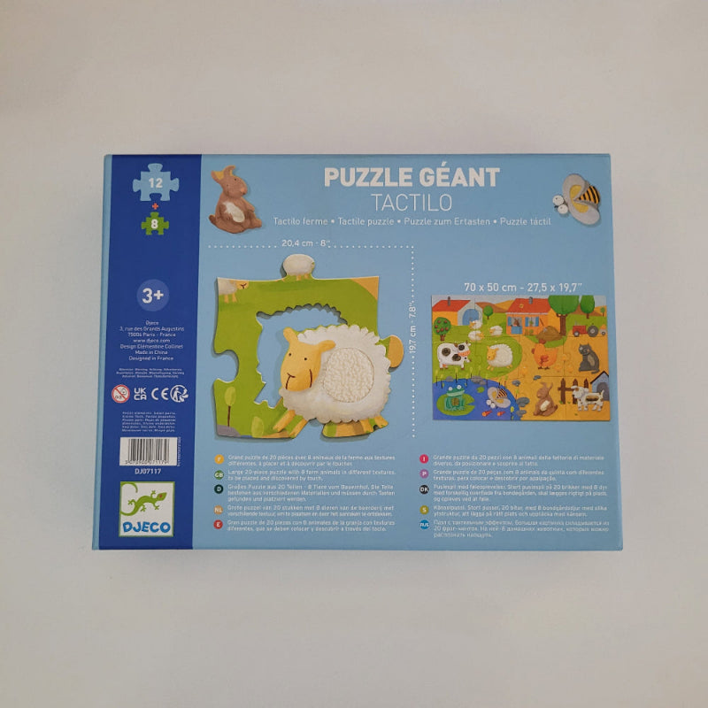 Children's puzzle packaging with a farm design on a blue background