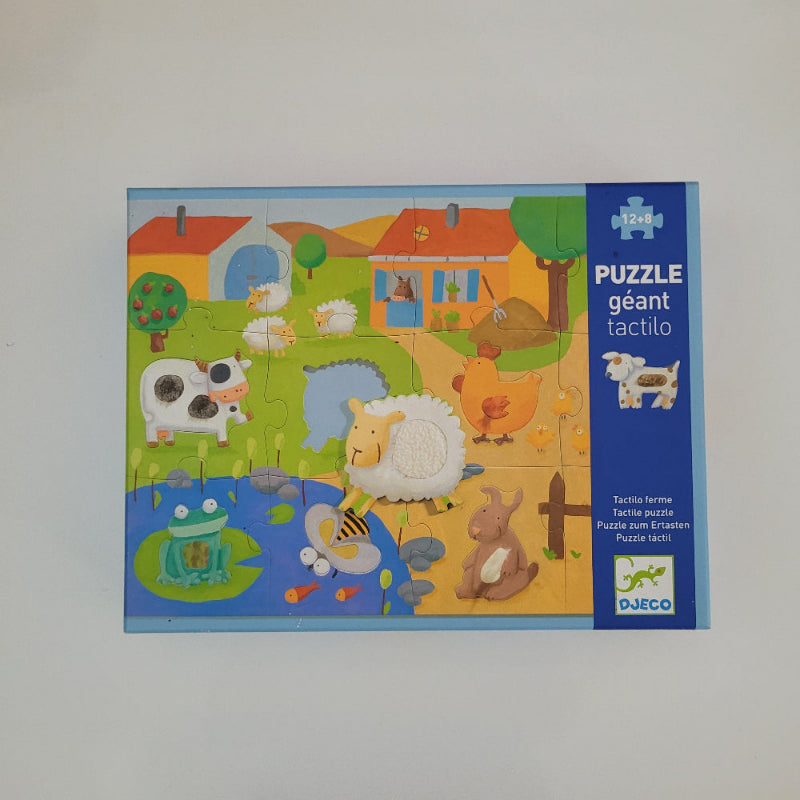 Children's puzzle box with colourful animal illustrations on a white background