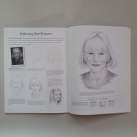 Open book with illustrations and text on a plain background