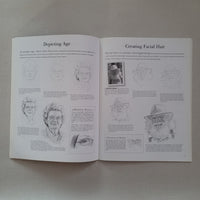Open book with illustrations and text relating to drawing facial hair on a plain background