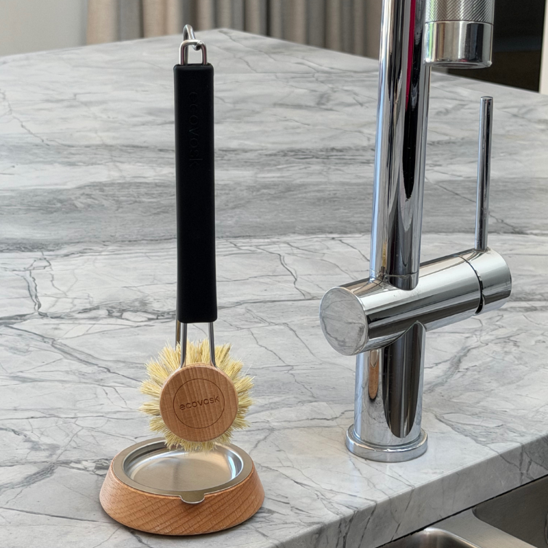 Dish Brush Stand with a dish brush sitting on a kitchen bench