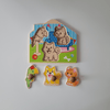 Wooden animal puzzle with pieces on a plain background