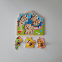 Wooden animal puzzle with pieces on a plain background