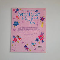 A pink children's activity book titled 'Fairy things to Stitch and Sew' by Usbourne Activities, displayed on a neutral light gray background.