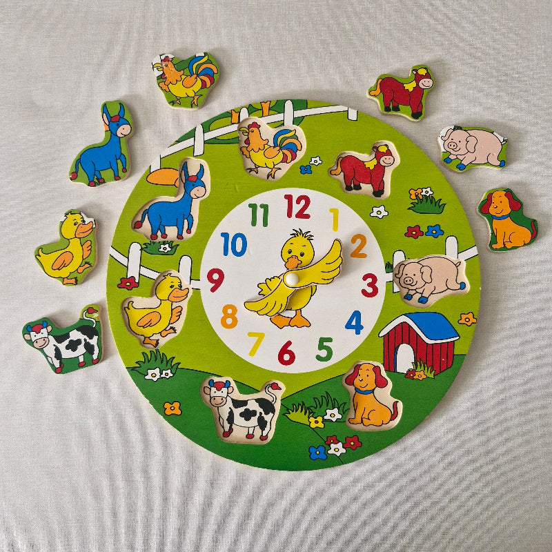 Children's wooden puzzle clock with animal pieces