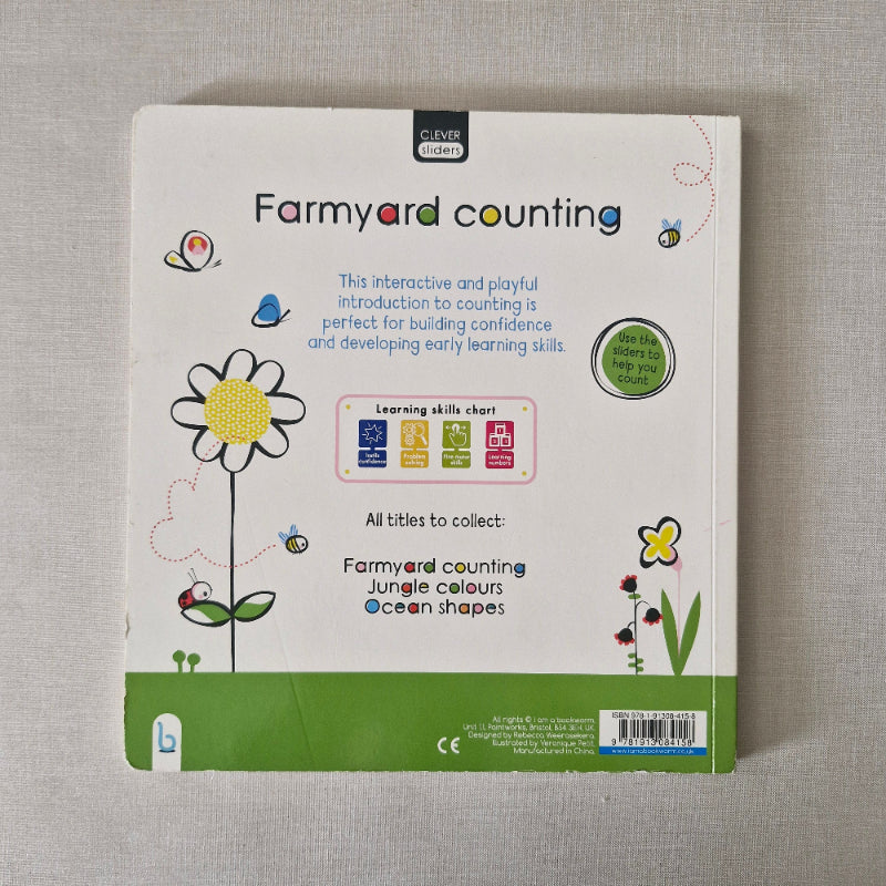 Back of a children's book with farmyard counting theme on a gray surface