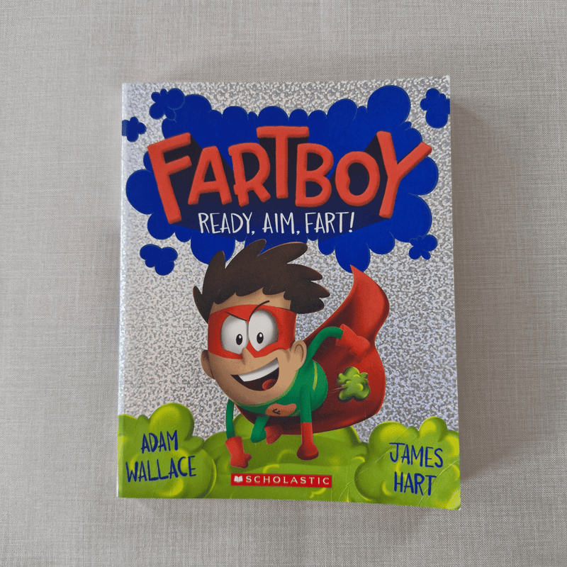Book cover of 'Fartboy: Ready. Aim. Fart!' with a superhero-like character on a textured background